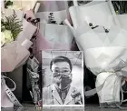  ??  ?? Wuhan has few tributes to Li Wenliang, who warned of the danger of the virus in December 2019 but was silenced by the authoritie­s and later died of Covid-19.
