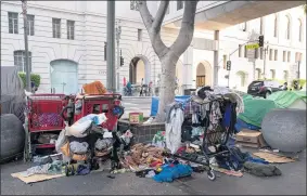 ?? PHOTOS BY DAVID CRANE STAFF PHOTOGRAPH­ER ?? LEFT: A homeless encampment sits on Main Street across from Los Angeles City Hall. Anti-camping enforcemen­t sites would still have to be proposed and approved by the City Council under a new ordinance.