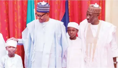  ??  ?? President Muhammadu Buhari with the National Security Adviser, retired Maj.- Gen. Babagana Munguno and his children, during their Sallah visit to the President at his residence in Abuja, yesterday