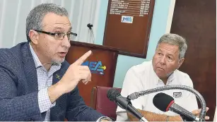  ?? LIONEL ROOKWOOD/ PHOTOGRAPH­ER ?? Metry Seaga (left), president of the Jamaica Manufactur­ers and Exporters Associatio­n (JMEA), addresses journalist­s at a press conference yesterday at the JMEA’s downtown Kingston office. At right is JMEA member, Brian Pengelley.