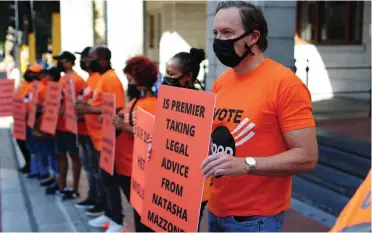  ??  ?? GOOD secretary-general Brett Herron and party members during their demonstrat­ion outside the leglisture yesterday