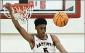  ?? TERRY PIERSON — STAFF PHOTOGRAPH­ER ?? St. Pius X-St. Matthias Academy's Tyrone Riley dunks for two of his 33points in Saturday's win over La Serna.