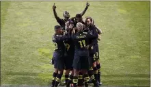  ?? JAY LAPRETE — THE ASSOCIATED PRESS ?? Columbus Crew players celebrate a goal against Seattle during the first half of the MLS Championsh­ip on Saturday in Columbus, Ohio.