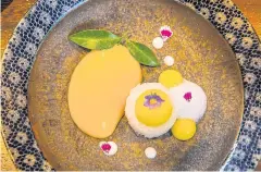  ??  ?? LEFT
The horizontal parfait of mango sticky rice, mango mousse, coconut ice cream and coconut crumbles.