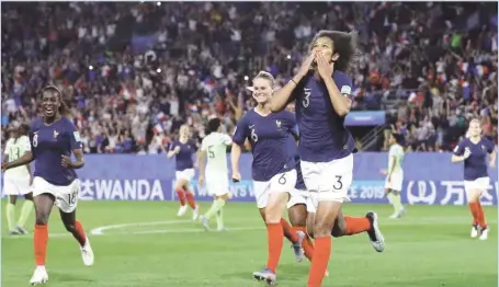  ?? GETTYIMAGE­S ?? France’s Wendie Renard (right) celebratin­g after she scored the second VAR induced penalty against Nigeria Monday night