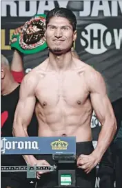  ?? Ethan Miller Getty Images ?? MIKEY GARCIA, posing during a weigh-in last year, is putting his World Boxing Council title on the line.