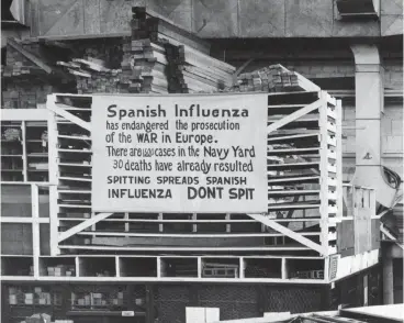  ?? Associated Press ?? “Many communitie­s passed laws banning spitting on the sidewalk to slow down the spread of the disease,” Dr. Ken Bridges said of the Spanish flu pandemic of 1918. “Spitting in public became rude because of that.” This Oct. 19, 1918 photo from the U.S. Naval History and Heritage Command shows a sign posted at the Naval Aircraft Factory in Philadelph­ia telling soliders stationed there not to spit to help stop the disease’s spread.