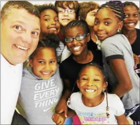  ?? PHOTO FROM RUPERT FACEBOOK PAGE ?? Rupert Elementary School Principal Matt Moyer with some of his students.