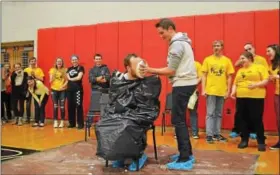  ?? COURTESY OF BASH CUB ?? During the high school’s pep rally on Friday, Feb. 10, Mr. Brian Langdon gets a pie in the face for coming in 1st place and collecting the most money.