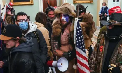 ?? Photograph: Saul Loeb/AFP/Getty Images ?? Jacob Chansley, wearing horns, at the Capitol on 6 January.