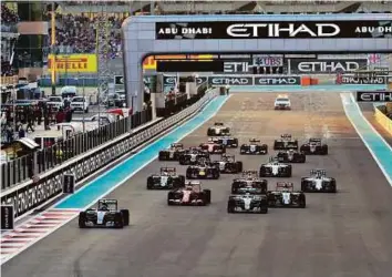  ?? Virendra Saklani/Gulf News Archives ?? Action from the Abu Dhabi Grand Prix last year, with Nico Rosberg and Lewis Hamilton of Mercedes leading the pack.