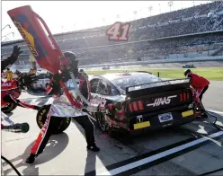  ?? AP Photo/John Raoux ?? Daytona: Cole Custer makes a pit stop for fuel and tires during the NASCAR Daytona 500 in Daytona Beach, Fla. Sunday's race was postponed because of rain.