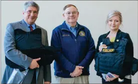  ?? Contribute­d ?? The vests were presented to District Attorney Christophe­r Arnt by Carlton Stallings, national trustee for the Georgia Fraternal Order of Police.