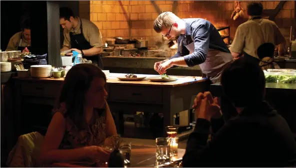  ?? PHOTOS: DEB LINDSEY/FOR THE WASHINGTON POST ?? Chef Jeremiah Langhorne likes to pile charred vegetables over a scoop of farro salad to create signature small plates at his restaurant.