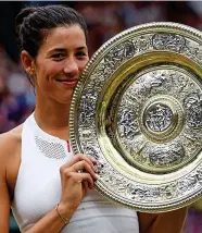  ??  ?? Golden girl: Muguruza celebrates