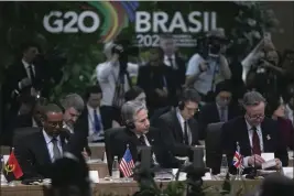  ?? BRUNA PRADO — THE ASSOCIATED PRESS ?? British Foreign Secretary David Cameron, right, U.S. Secretary of State Antony Blinken, center, and Angola’s Economic Cooperatio­n Minister Jose Massano, left, attend the G20 foreign ministers’ meeting in Rio de Janeiro, Brazil, Wednesday.