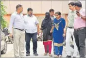  ?? RAVI CHOUDHARY ?? The woman (in black) arrested on Saturday for the murder of a retired government official at his flat in Mayur Vihar.