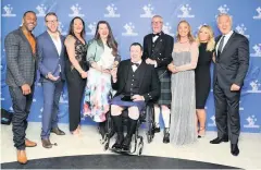  ??  ?? Celebratio­ns Fiona MacDonald of Bravehound, fourth left, celebrated the charity’s National Lottery Award in 2017