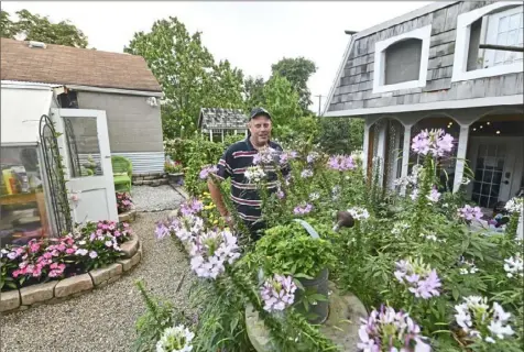  ?? Nate Guidry/Post-Gazette ?? Robert Couture was the winner of the medium category of last year’s Great Gardens Contest for the garden at his home in Crafton Heights.