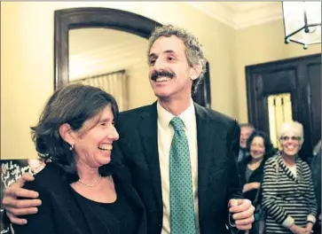  ?? Katie Falkenberg
Los Angeles Times ?? MIKE FEUER thanks his wife, Gail, as he speaks to supporters and campaign staff at an election night party. The challenger garnered the most votes in the four-candidate contest for Los Angeles city attorney.