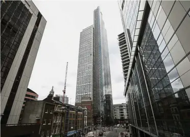  ??  ?? Pull of London: Office buildings in London’s financial district. Australian­Super Pty, which has A$120bil in assets, is looking to invest more overseas in real estate and infrastruc­ture. — Bloomberg