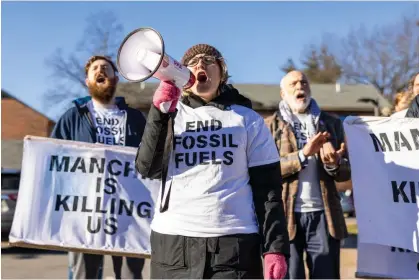  ?? Scott Eisen/Getty Images ?? Members of Climate Defiance protest against Joe Manchin outside an event in Manchester, New Hampshire, on 12 January 2024. Photograph: