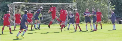  ?? Match report and photos: Derek Black ?? Saints central defender David McPhee gets his header on target but it was well saved by Sean Gibbons.