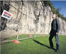  ?? Picture / Dean Purcell ?? Former New Zealand Alpine Club president Peter Cammell looks at the climbing wall of the old Mt Eden quarry.