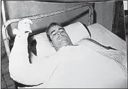  ?? AP file photo ?? Prisoner of war John McCain lies in a hospital after his capture in 1967. A few months into McCain’s imprisonme­nt, his father, Adm. John S. McCain Jr., became commander of the U.S. war effort in Vietnam.