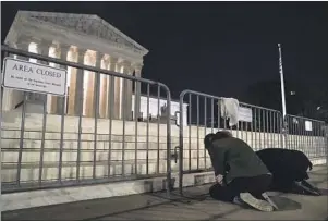  ?? Kent Nishimura Los Angeles Times ?? PROTESTERS gather outside the Supreme Court building on Monday night after a draft of a decision was leaked saying Roe vs. Wade would be overturned.