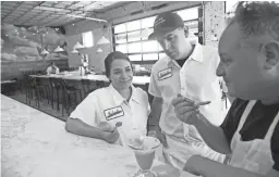  ??  ?? Nadia Holguin, from left, Armando Hernandez and Chris Bianco now manage the food and beverage program at the Graduate Tempe.