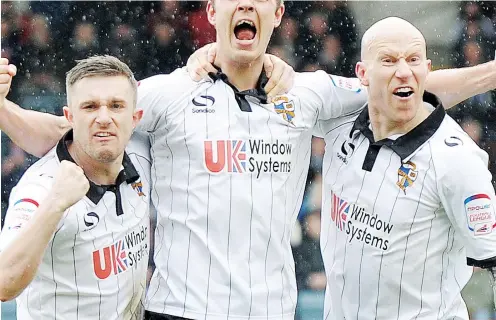  ?? PICTURE: Action Images ?? CONSISTENT: Tom Pope, centre, celebrates scoring another for Port Vale with Lee Hughes, right, and Doug Loft