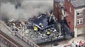  ?? WPVI-TV/6ABC via AP ?? Smoke rises from an explosion Friday at the R.M. Palmer Co. chocolate factory in West Reading, Pa. Two people were killed and five were missing, authoritie­s said Saturday.