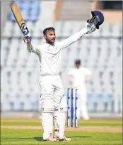  ??  ?? Aditya Waghmode of Baroda celebrates his century against Mumbai during a Ranji cricket match at Wankhede stadium in Mumbai on Friday.