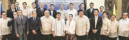  ??  ?? President Duterte with (front row, from left) Andrew Tan for Travellers Internatio­nal Hotel Group Inc., Melco Internatio­nal’s Lawrence Ho, Bloomberry Resorts Corp.’s Enrique Razon, PAGCOR president and COO Alfredo Cereza Lim, Executive Secretary...