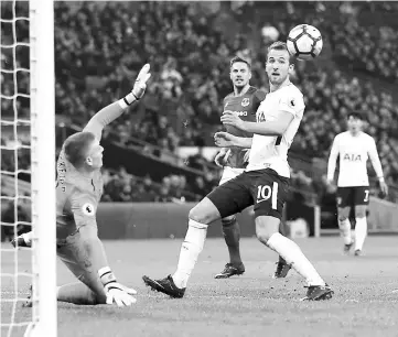  ?? — AFP photo ?? Tottenham Hotspur’s Harry Kane (right) scores the team’s third goal during the English Premier League match against Everton at Wembley Stadium in London.