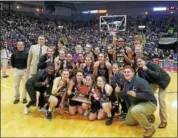  ?? PHOTO COURTESY BERKS CATHOLIC ATHLETICS ?? The Berks Catholic girls basketball team celebrates with the league trophy after winning the county title last Friday in Reading.