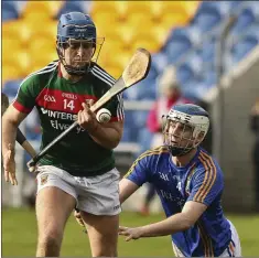  ??  ?? Mayo’s Kenny Feeney is challenged by Wicklow’s Martin O’Brien.