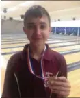  ?? JOHN KAMPF — THE NEWS-HERALD ?? Ryan Chipps, a freshman at Fairport, shows off the individual medalist award he won with his 672 series at the Division II district tournament.