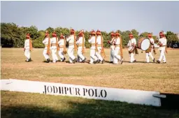  ??  ?? FROM BELOW: A brass band plays before the polo match; Royal Salute Polo Ambassador Malcolm Borwick gives some pointers during the polo clinic