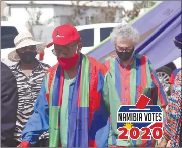  ??  ?? Welcome… Vice President Nangolo Mbumba arrives at the Windhoek West district rally, accompanie­d by the Khomas regional governor Laura McLeod-Katjirua and outgoing Windhoek West constituen­cy councillor George Trepper.