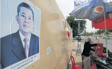  ?? REUTERS ?? A poster of Cambodia’s Prime Minister and Cambodian People’s Party President, Hun Sen, is seen in Phnom Penh yesterday.