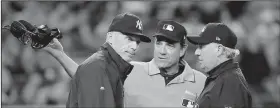  ?? AP file photo ?? Former New York Yankees Manager Joe Girardi (left) still has his finger on the pulse of the game as an MLB Network analyst, but he’s also spending quality time with his family as he plans for a return to the dugout.