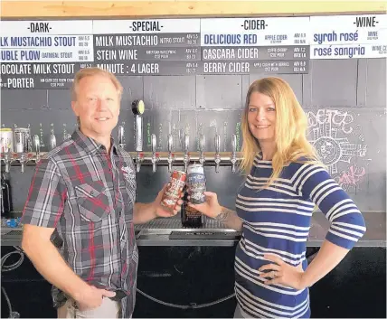  ??  ?? Tractor Brewing owners David Hargis and Skye Devore toast their pending expansion into the Texas retail beer market in El Paso. Sales are scheduled to begin the first week of June.