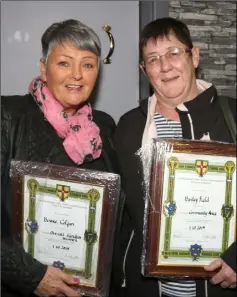  ??  ?? Bernie Colgan, overall overall garden winner, withTerry Cullen who collected the community award for Barley Field on behalf of Thomas Cullen.