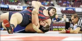  ?? DIGITAL FIRST MEDIA FILE PHOTO ?? Boyertown’s Tommy Killoran closes in on a pin against Exeter’s Oscar Daniels in the 285-pound quarterfin­al at the PIAA Wrestling Championsh­ips in Hershey.