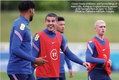 ??  ?? Conor Coady of Wolves, and Tyrone Mings of Aston Villa, during an England training session at St George’s Park on June 10, 2021 (Photo by Catherine Ivill/getty Images)