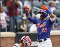  ?? COREY SIPKIN - THE ASSOCIATED PRESS ?? New York Mets’ Javier Baez gestures at home plate after his two-run home run that also scored Michael Conforto during the fourth inning of a baseball game against the Washington Nationals, Sunday, Aug. 29, 2021, in New York.