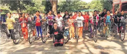  ??  ?? Rebecca Lucas, from Macclesfie­ld Academy, delivered 24 bikes and armfuls of handmade clothes to needy children in Cambodia.