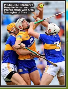  ?? ?? pressure : Tipperary’s Barry Heffernan and Padraic Maher with Aron Shanagher of Clare